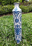 Tall blue scrollwork vase, view 1