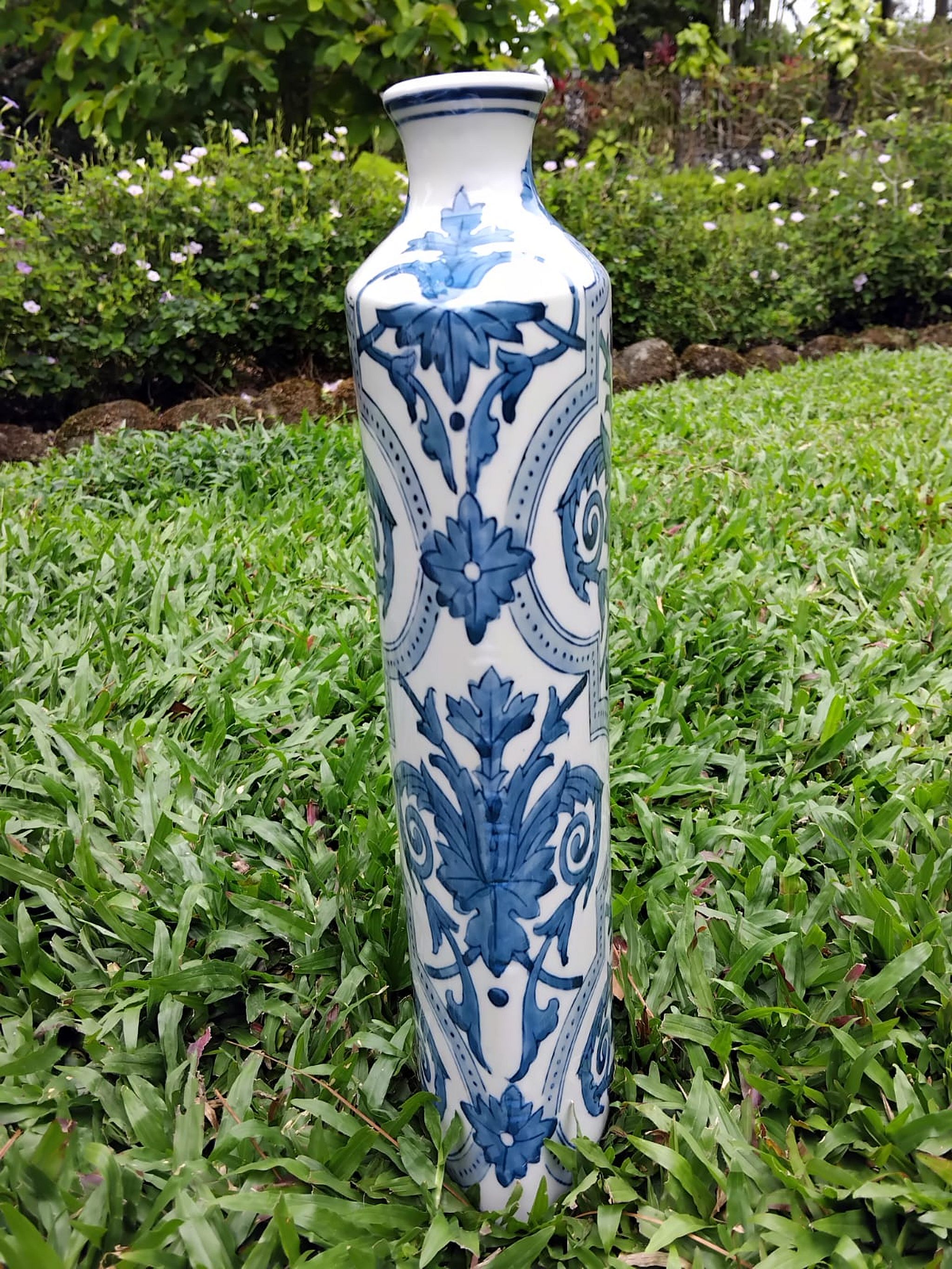 Tall blue scrollwork vase, view 1